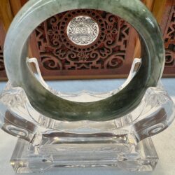 Jade bracelet showing natural veining and translucence