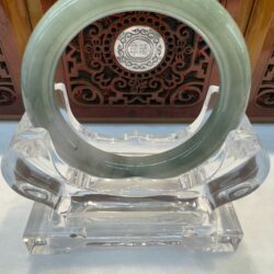 Symmetrical light green jade bangle portrait