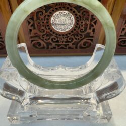Smooth green jade circular bracelet display