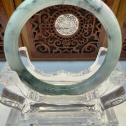 Speckled dark-green jade bangle front view