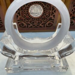 Opaque white jade bangle on stand