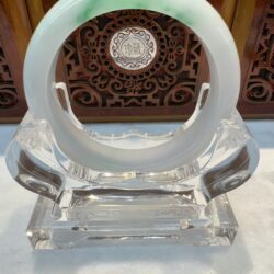 White jade bangle with vibrant green highlights