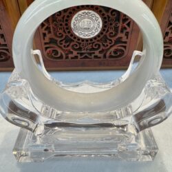 Pale jade bangle on clear stand