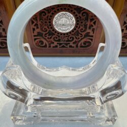 Front view pale jade bangle with carved panel