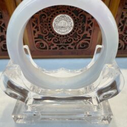 Circular white jade bangle with carved backdrop
