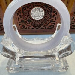Pale lavender jade bangle on crystal stand