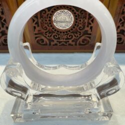 White jade bangle on crystal display