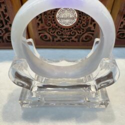 Pale lavender jade bangle on crystal stand