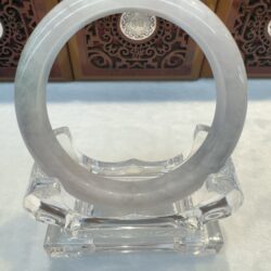 Light lavender green jade ring on stand