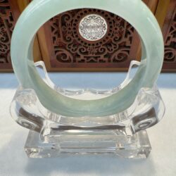 Front view jade bangle with carved backdrop