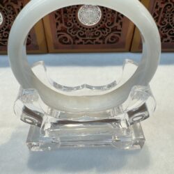 Polished circular jade bracelet close-up view