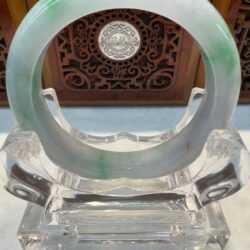 Translucent jade bracelet with carved backdrop
