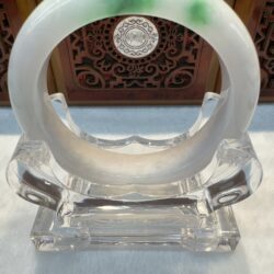 White jade bangle with vivid green spot