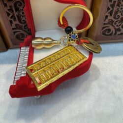 Keychain with copper coin and abacus
