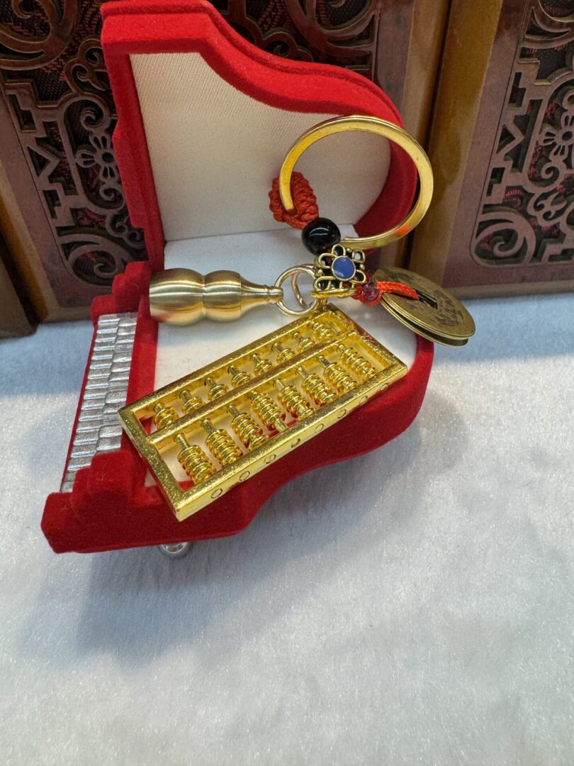 Keychain with copper coin and abacus