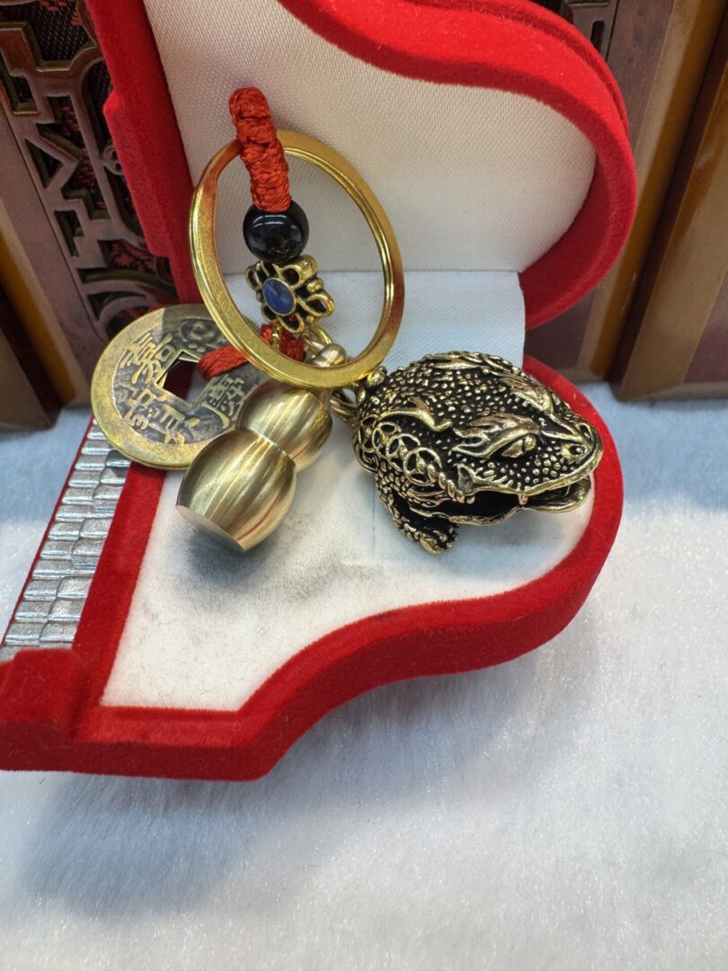 Keychain with copper coin and money frog
